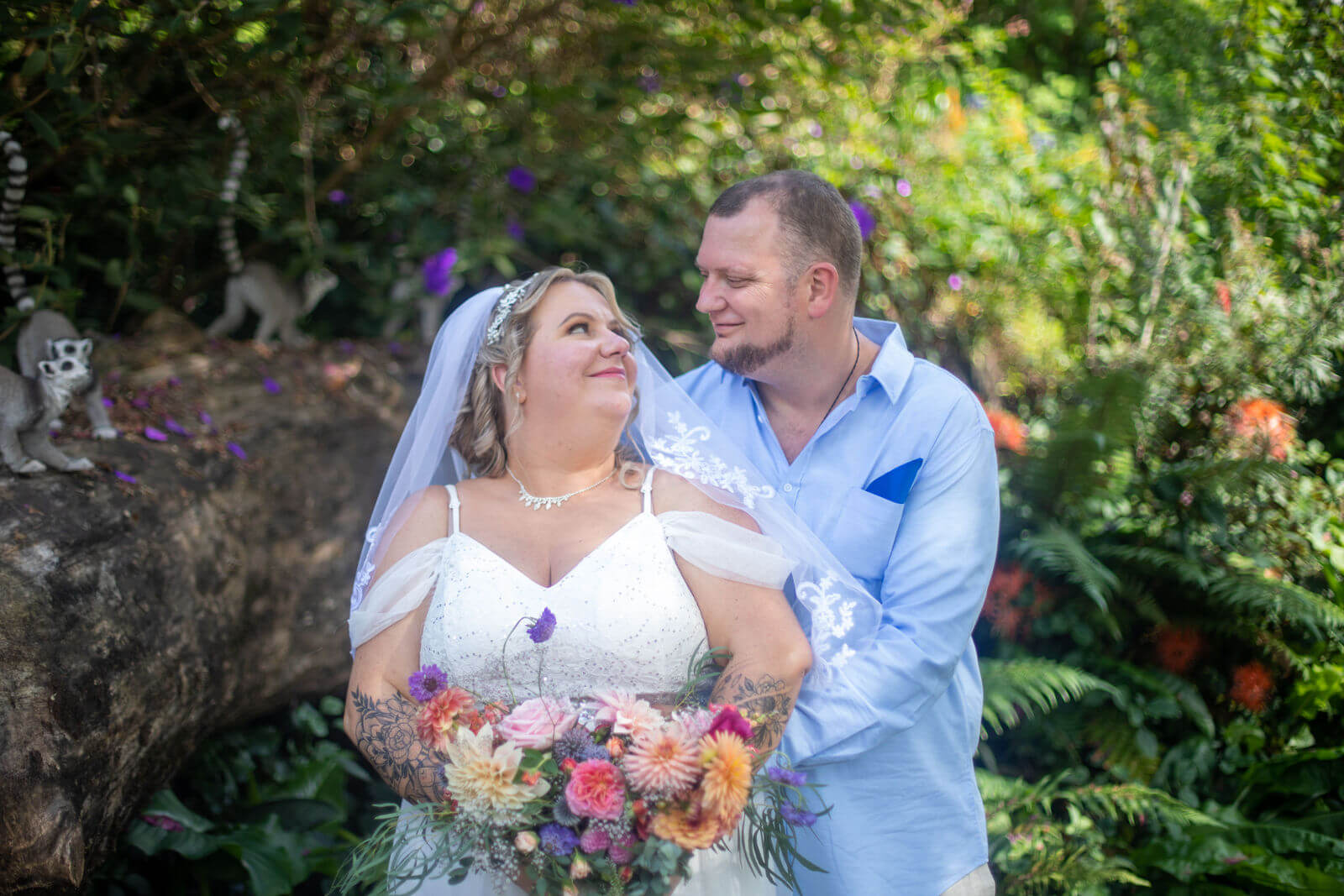 Auckland wedding photographer — bride and groom portrait in lush tropical garden