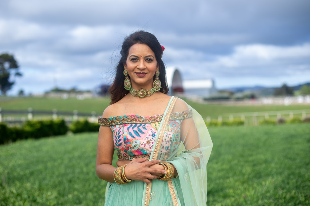Auckland portrait photographer — portrait in teal lehenga outdoors