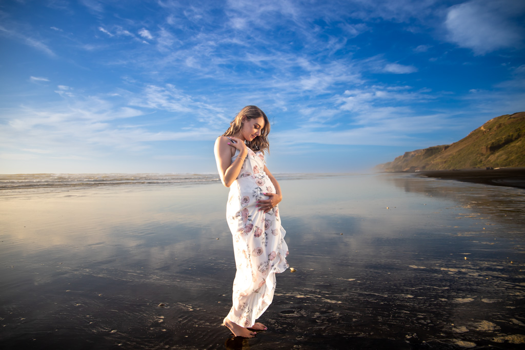 Auckland maternity photographer — black sand beach at golden hour