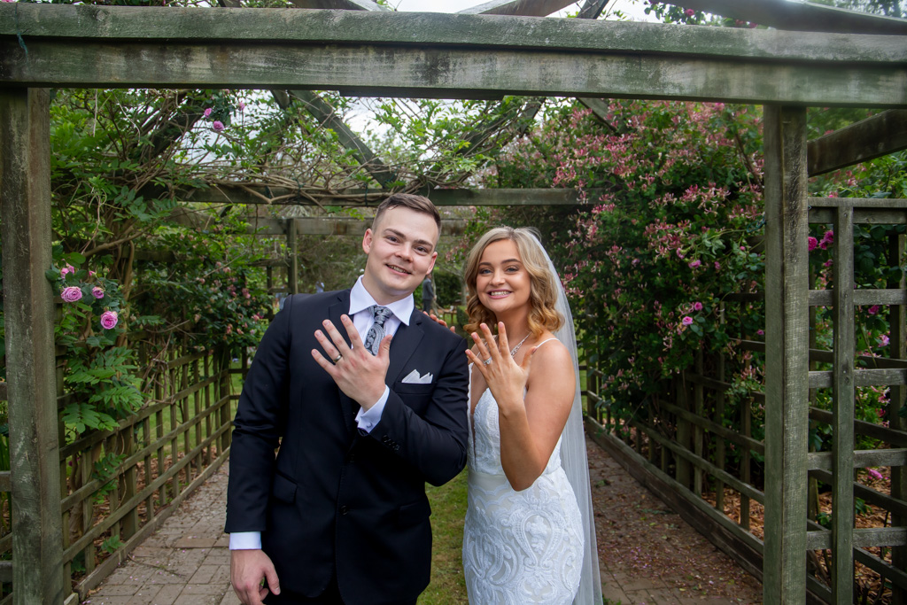Auckland wedding photographer — couple proudly showing wedding rings