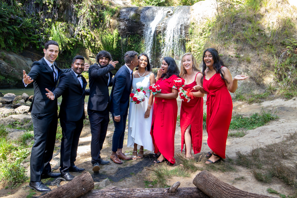 Auckland wedding photographer — bridal party at waterfall